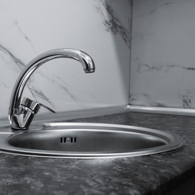 Pull-out kitchen mixer over a stainless sink